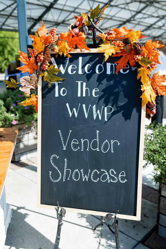 Chalk board welcome sign to the WVWP Wedding Showcase at Log House Garden