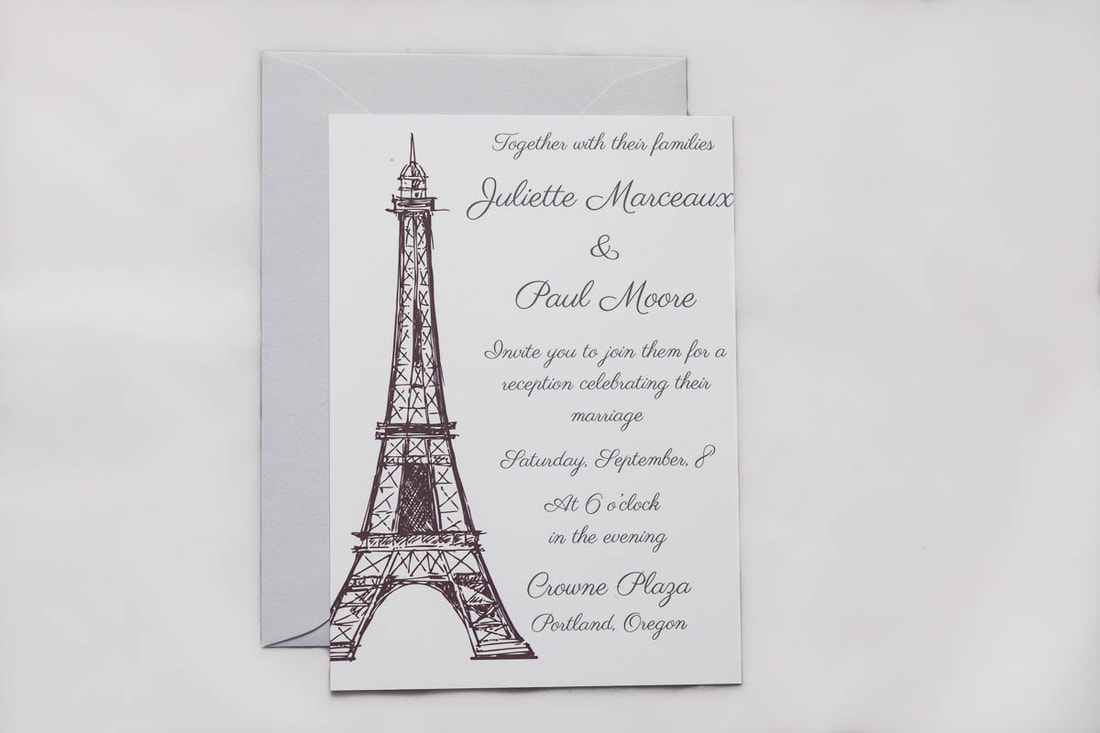 Pairs Eiffel Tower wedding announcement with envelope