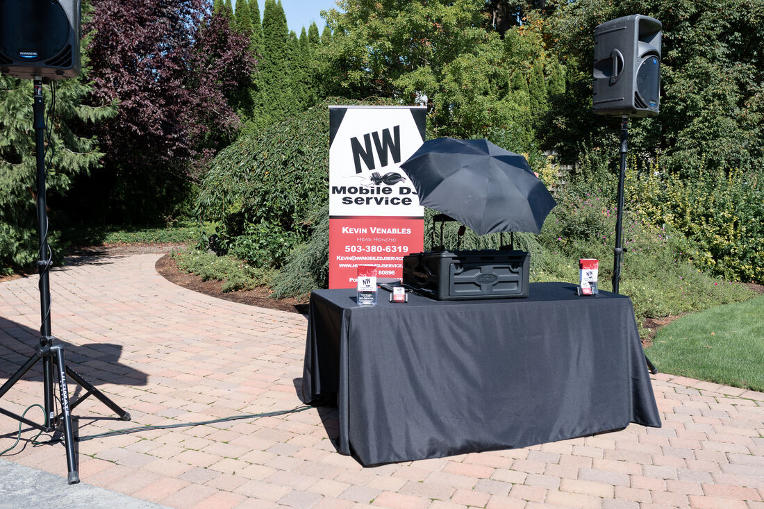 NW Mobile DJ Service at the 2020 Willamette Valley Wedding Professionals Wedding Showcase at Log House Garden at Willow Lake.